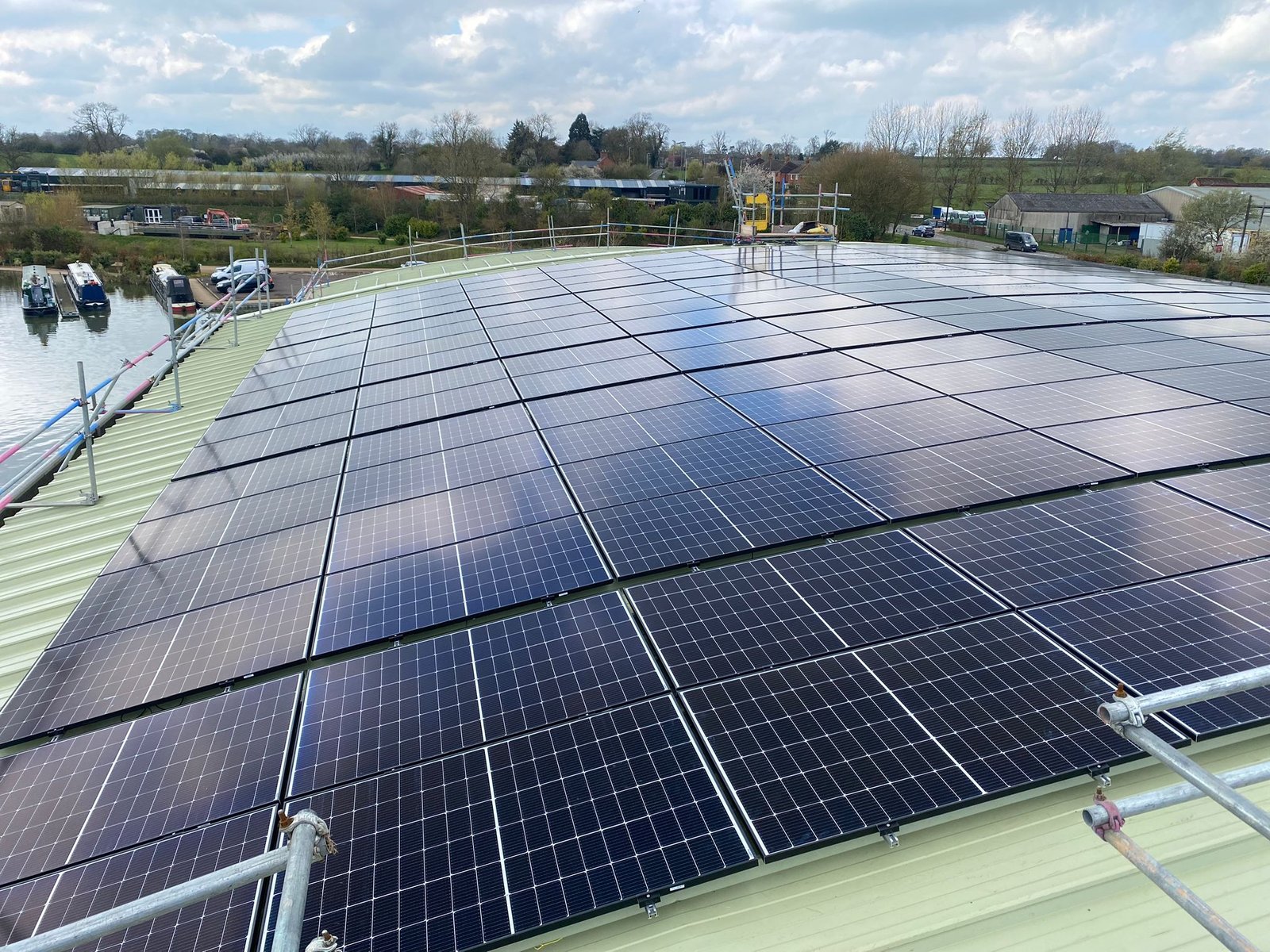 Image of the Kilworth Marina 130 Kilowatt Roof Mounted Solar Panels Install on left of building